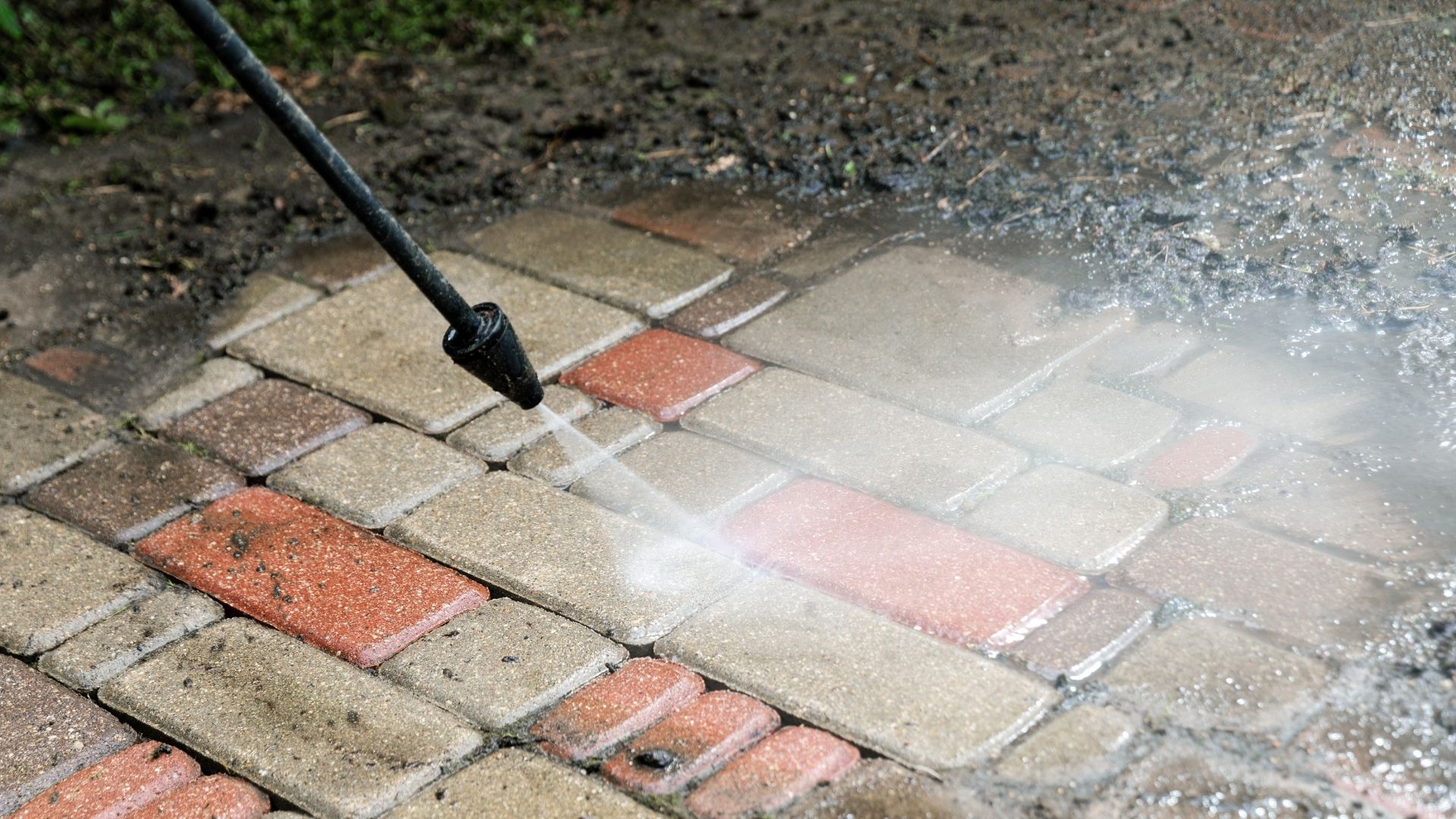 High-pressure cleaning of dirty pavers, part of Trevor’s pressure washing and property maintenance services in Casino, Kyogle, Lismore, Coraki and surrounding areas.